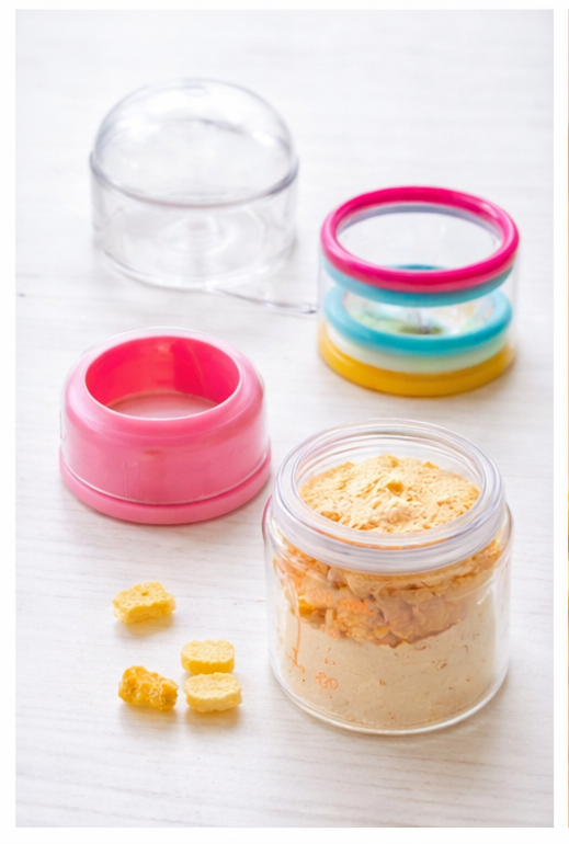 baby feeding bottle with silicone teether rings & storage cap